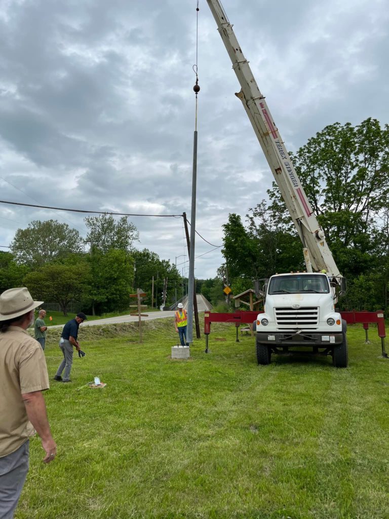 A crane being used to install the art project.